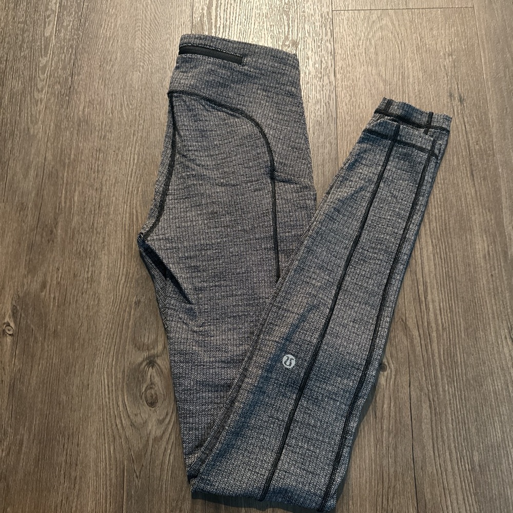 Lululemon fast pace legging size 4 sold out style and color way black and grey